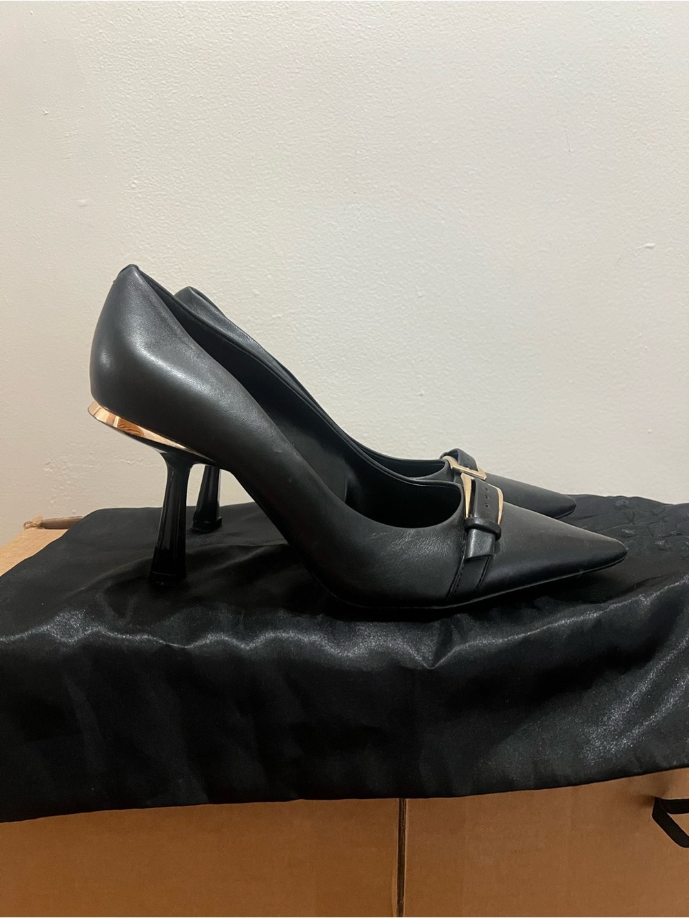 Vince Camuto Black Pointed Toe Pumps with Gold Buckle and Heel Accent